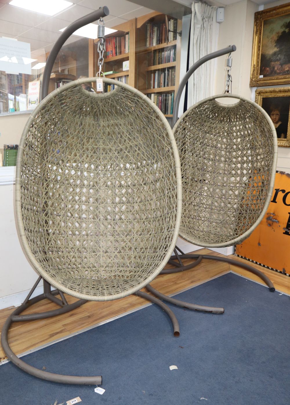 A pair of hanging rattan chairs